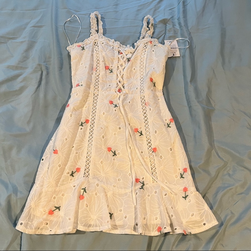White floral dress a little stain in front, will go away with wash
